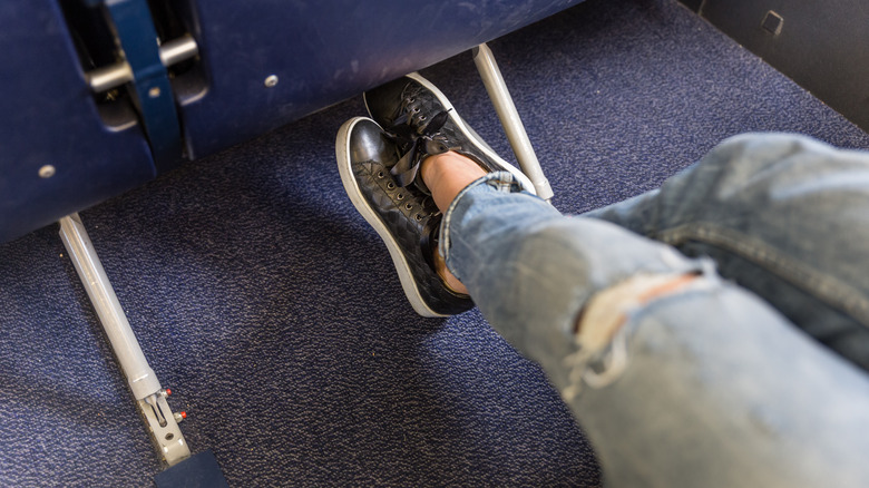 woman's legs on airplane