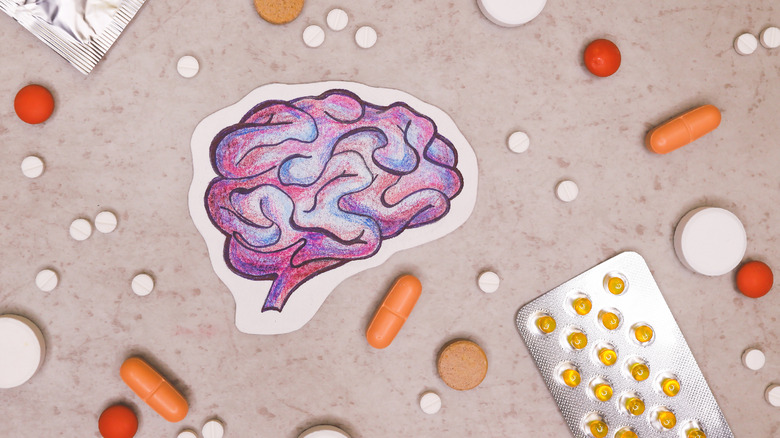 illustration of the brain surrounded by pills