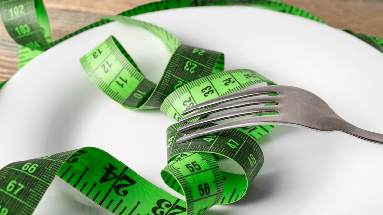 plate with green measuring tape