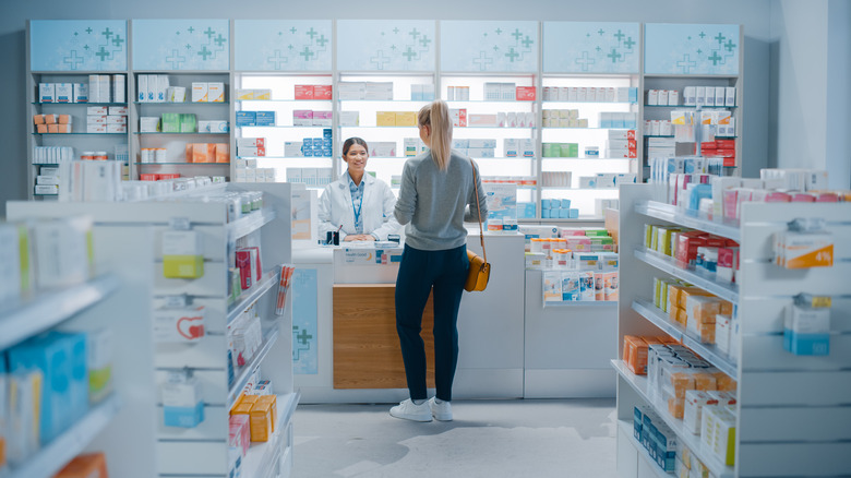 Woman speaking with pharmacist