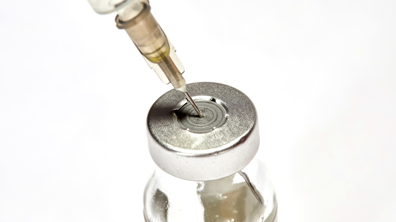 Syringe in a medication vial