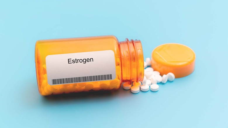 estrogen pills spilling out of a prescription bottle