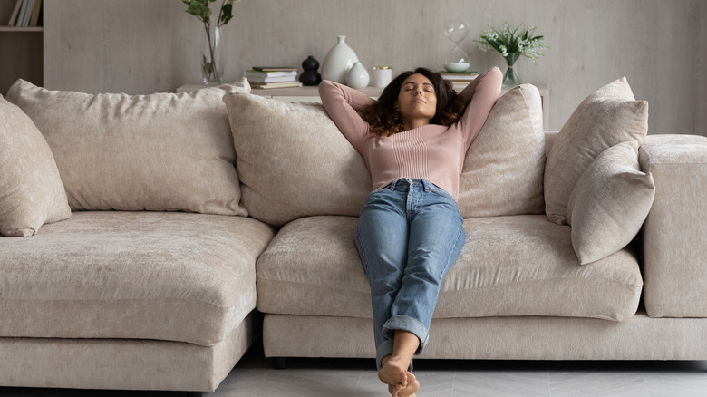 woman relaxing on couch