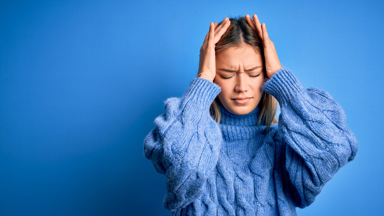 woman experiencing a headache