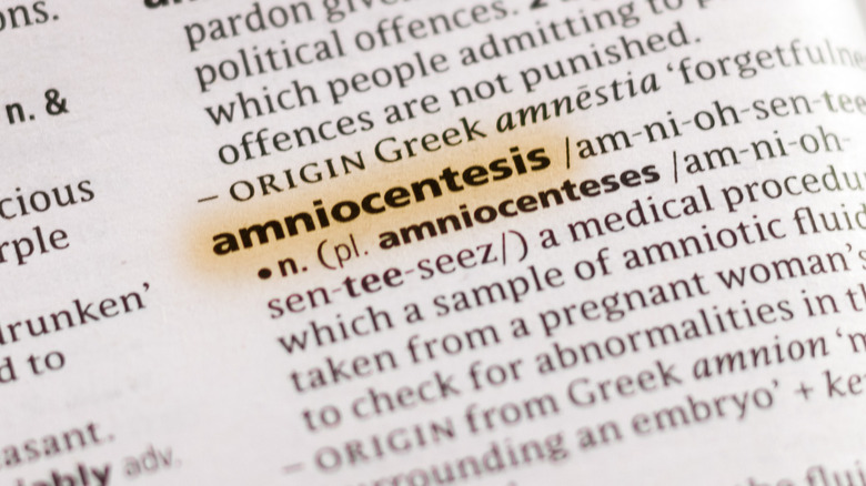 open dictionary with word amniocentesis highlighted