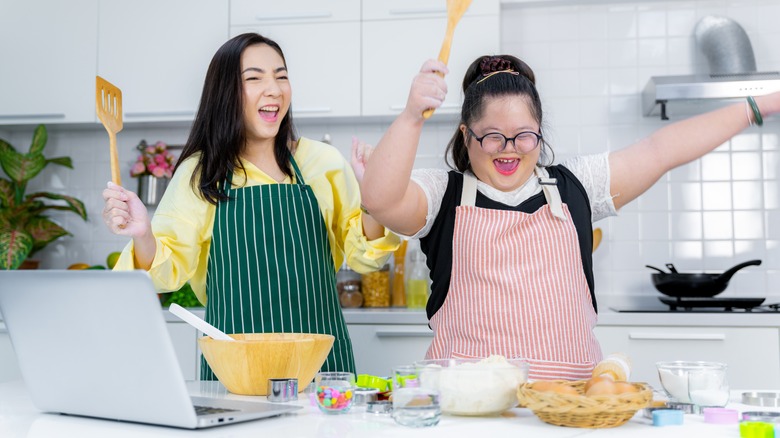 Mom and daughter with Down syndrome cooking