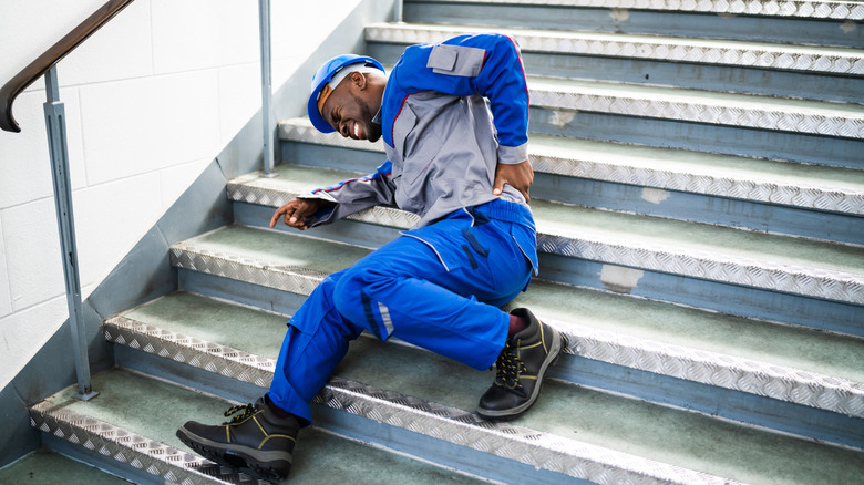 man falling on stairs