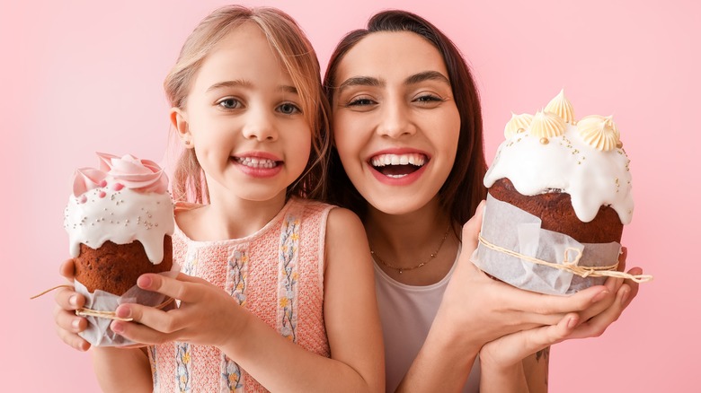 Mother and daughter with cakes