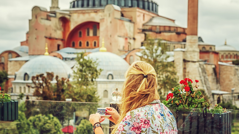 Woman drinking coffee in Europe