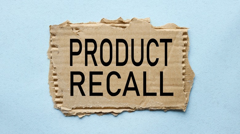 Product recall sign on piece of cardboard