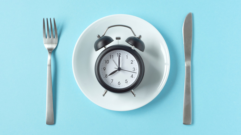 Alarm clock sitting on a white plate