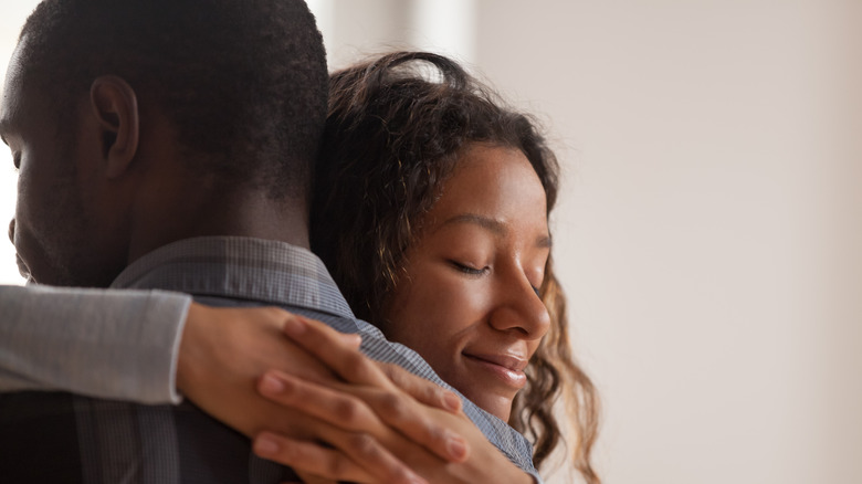 African American couple embracing