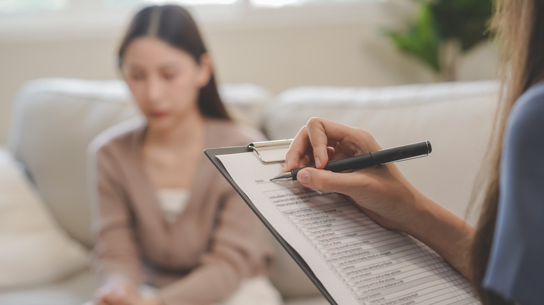 Caregiver with RX clipboard