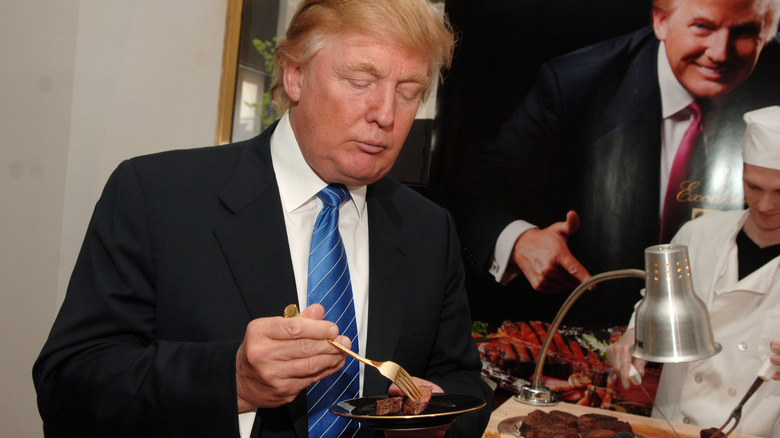 Donald Trump eating steak at the launch of Trump steaks in 2007