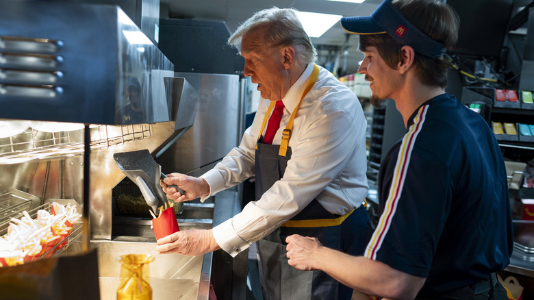 Donald Trump at McDonald's in 2024 shoveling fries into a serving container