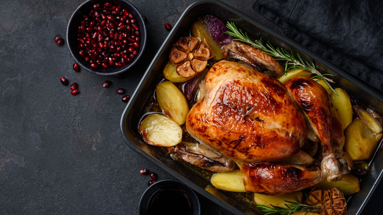 overhead of roasted chicken and potatoes