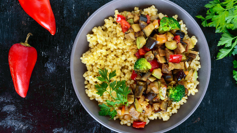 couscous in a bowl with peppers and veggies