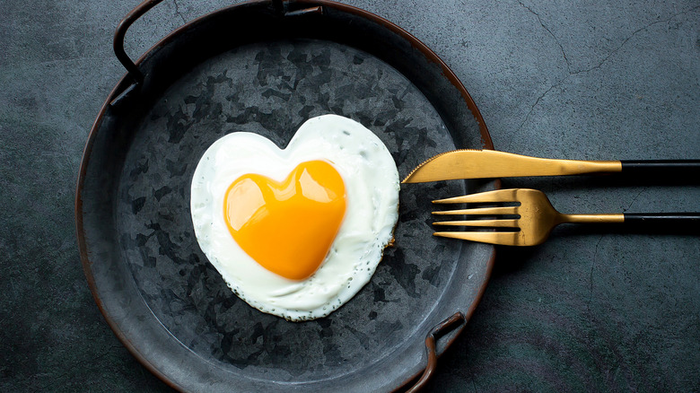 heart shaped egg in pan