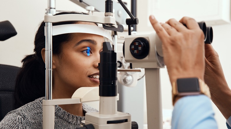 woman getting eye exam