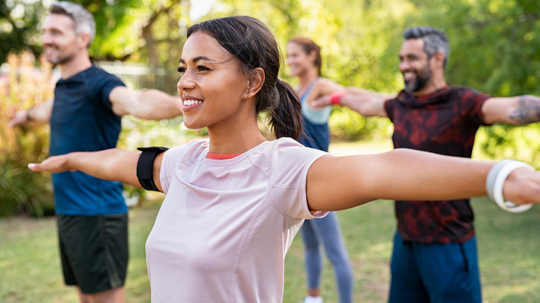 Group of people exercising outside 