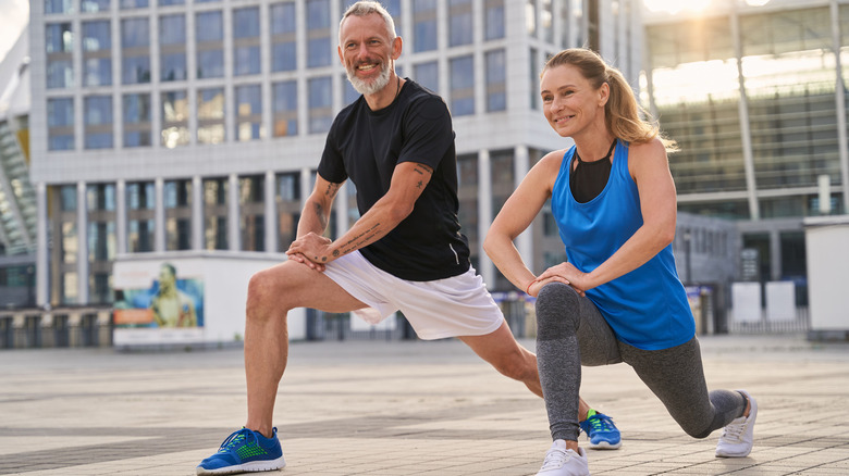 couple stretching after working out