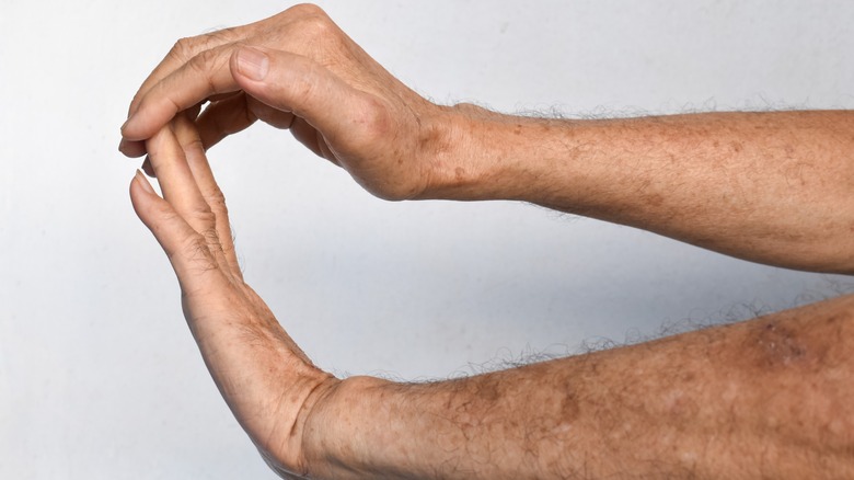 man performing wrist extension