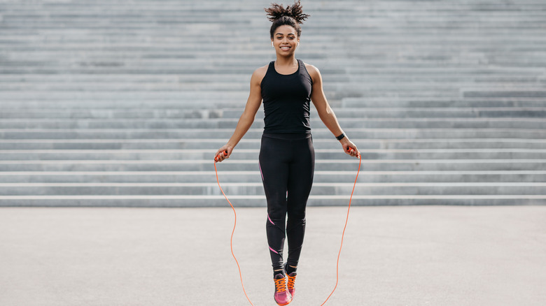woman jump roping outside