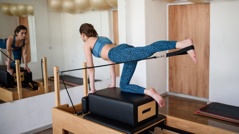 woman doing pilates in a studio