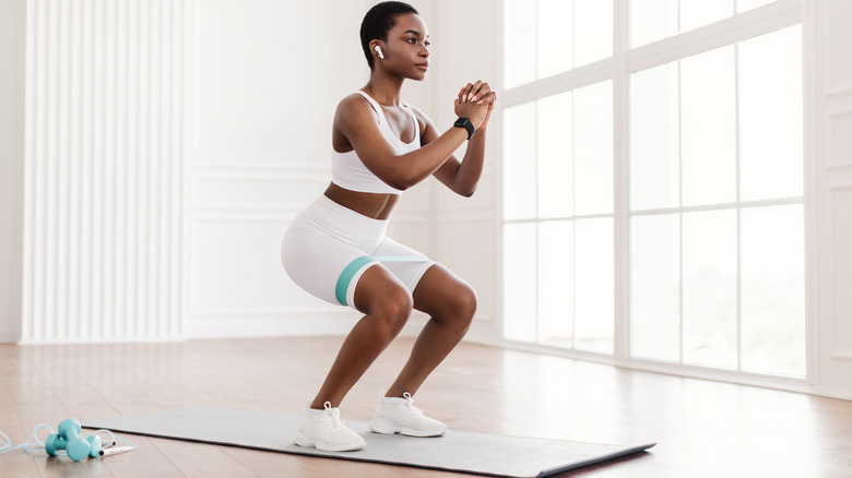 woman doing a squat