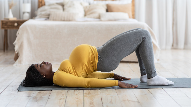 Pregnant woman doing yoga 