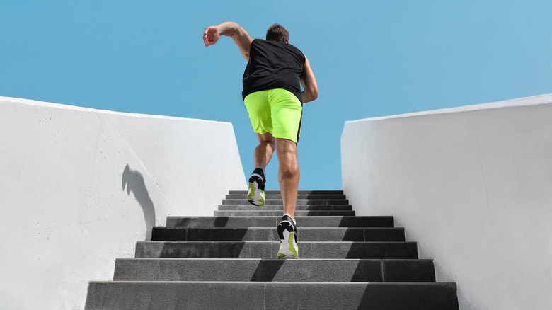 Man running up steps outdoors