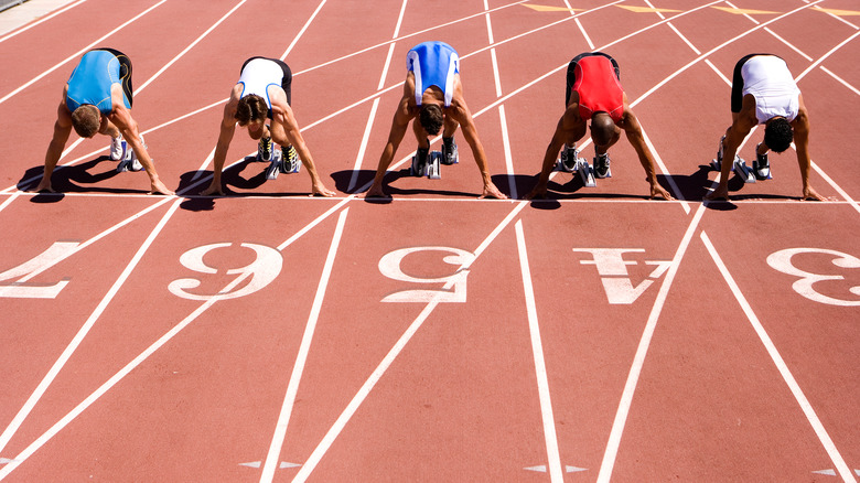 Athletes preparing to sprint