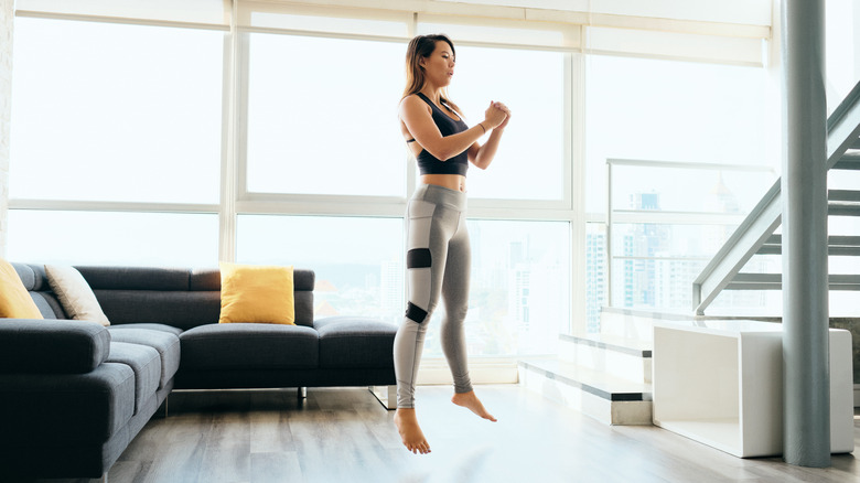 woman launching into a jump squat