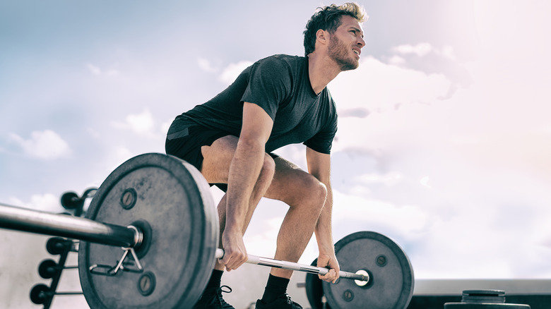 man doing deadlifts