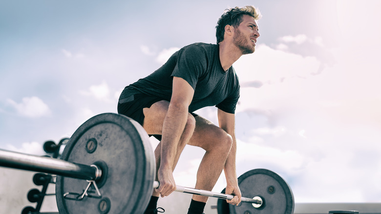 Man preparing to lift heavy barbell