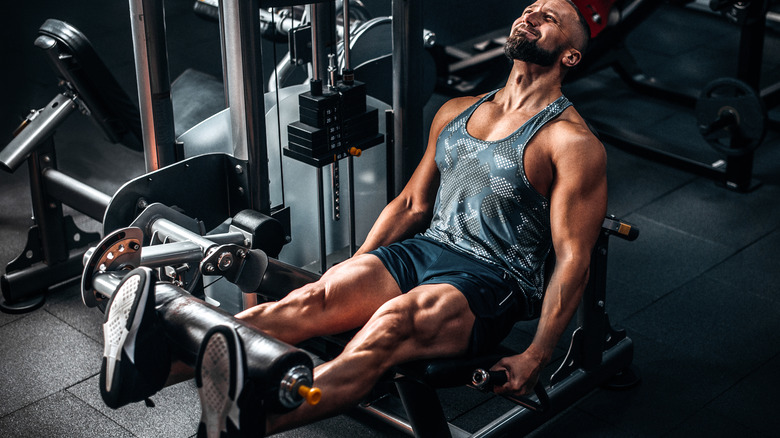 Man on leg extension machine