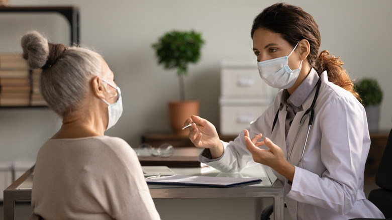 Doctor consulting with patient