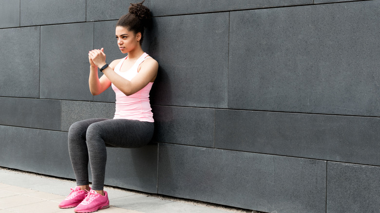 woman performing wall sit