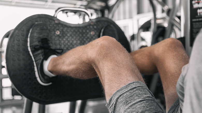 man doing leg press