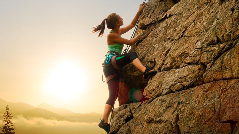 woman rock climbing