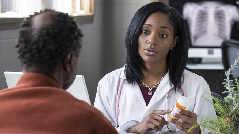 Patient discussing medications with doctor