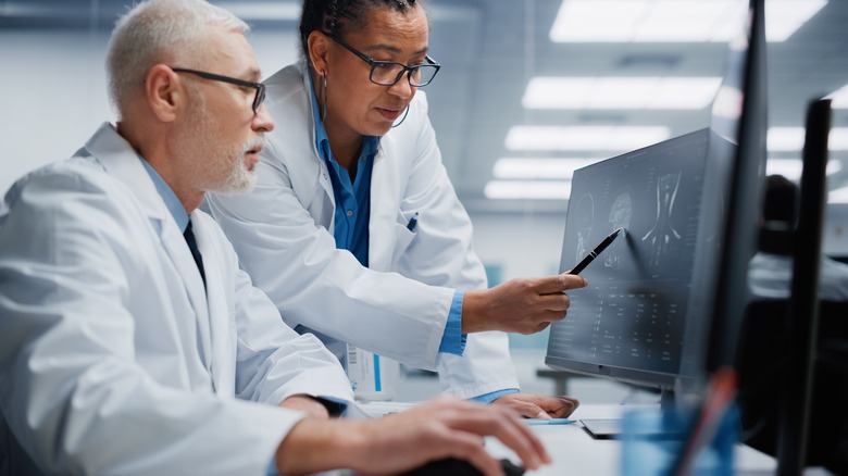 Doctors examining X-ray scans