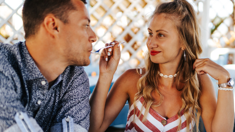 Couple eating oysters together 