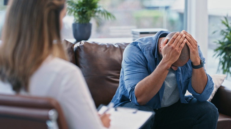 man looking unhappy at doctor