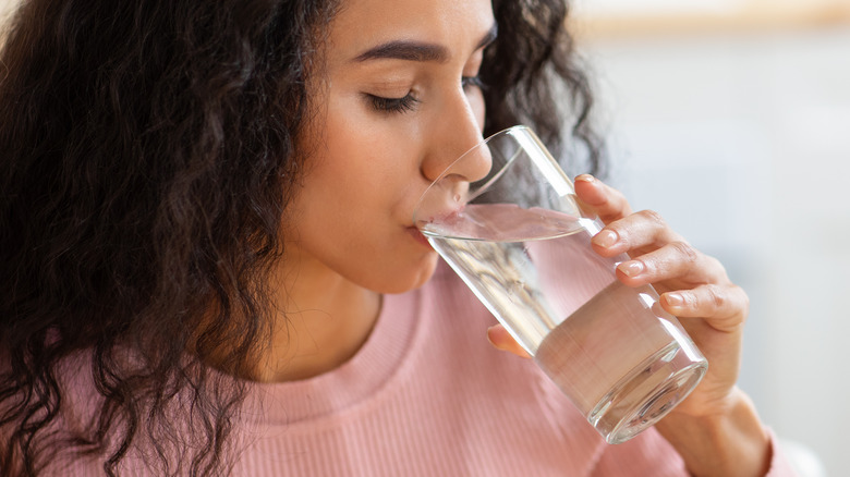 Woman drinking glass of water