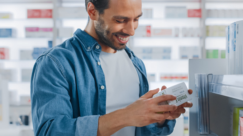 Man checking prescription label