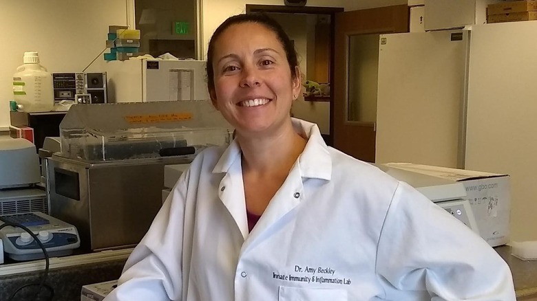 Dr. Amy Beckley in her lab, wearing a personalized lab coat