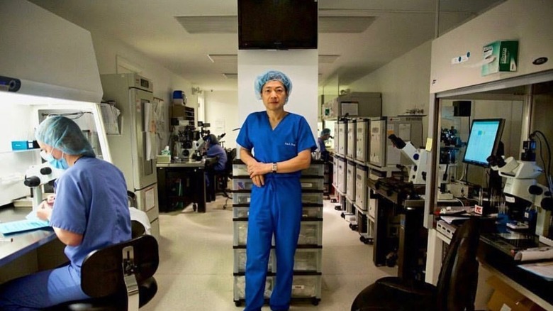 Dr. Zhang posing in lab