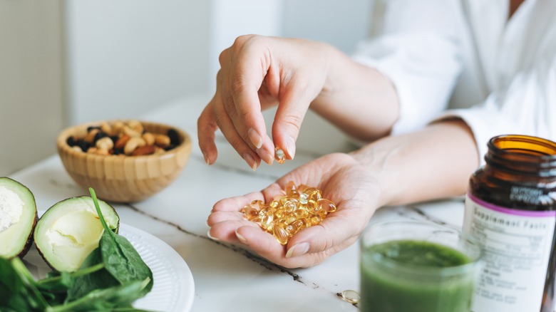 Woman taking omega-3 supplement 