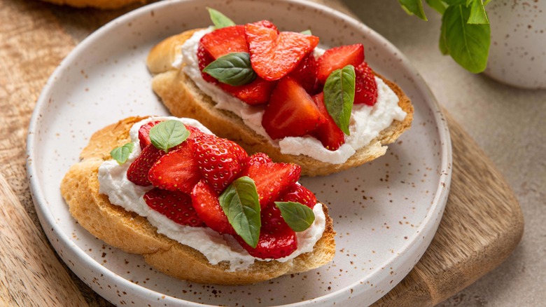 Plate of ricotta toast with berries
